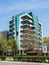 The modern building of the Faculty of Pharmacology of the Medical University in Varna on a sunny spring day. Vertical frame