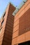 Modern building with terracotta brick facade. Banco Popolare Palace in Lodi designed by the architect Renzo Piano