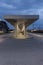 Modern bus stop shelter in Mendrisio. There is a long, lighted corridor with several stops