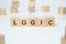 Modern business buzzword - logic. Word on wooden blocks on a white background