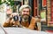 Modern business. Old technology. Professional photographer use vintage camera. Photography business. Bearded man hipster
