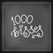 Modern calligraphy lettering of 1000 kisses in white on chalkboard background