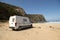 Modern campervan parked in one of the most beautiful beaches in the Algarve Portugal.