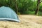 Modern camping tent in forest