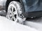 Modern car fragment, wheel in snow