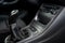 Modern car interior: steering wheel, gearshift lever, multimedia system. Manual transmission driving. Car gearbox lever.