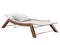 Modern chaise lounge with fabric upholstery and wooden base. 3d render