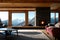 Modern chalet interior. Wooden chalet in the mountains, snowy forest. generative ai