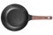 modern Chef's kitchen large frying pan with non-stick coating in dark gray color and a stylized wood handle on a white