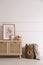 Modern child room interior with wooden cabinet and different accessories. Space for text