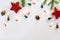 Modern Christmas composition. Christmas toys, brown and red decorations, spruce branches, festive lights on a white background. Fl