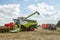 Modern claas combine harvester cutting crops