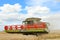 Modern class combine harvester with header in the air