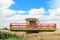 Modern class combine harvester with header in the air