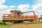 Modern class combine harvester with header in the air