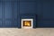 Modern classic dark blue interior with fireplace, wall panels, wooden floor.