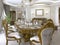 Modern classic dining table in a luxurious baroque living room with serving