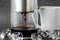 Modern Cold brew drip tower coffee maker on dark stone background