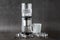 Modern Cold brew drip tower coffee maker on dark stone background