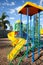 Modern colorful kids playground - swings, slides, steps and ladders. Outdoor plastic playing area for children