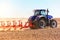 modern combine harvester works in the field. Sowing and harvesting.