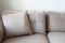 Modern comfortable sofa in bright living room, close up with decorative pillows, stylish interior