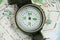 Modern compass on map