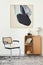 Modern composition of living room interior with design chair, wooden bookcase, table lamp, book, carpet, decoration and mock up.