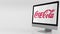 Modern computer screen with Coca-Cola logo. 4K editorial clip
