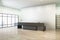 Modern concrete office interior with window and city view, wooden flooring, black reception desk and mock up place on wall. Lobby