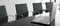modern conference room decorates interior with white wall tone, black chairs, and laptop on table.