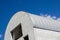 Modern construction. Metal ribbed arch-span roof covering. Looking up .