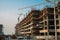 Modern construction site with industrial cranes in Dubai. Urban development