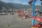 Modern container terminal in the Port of La Guaira observed from cargo ship moored below gantry cranes.