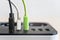 Modern convenient multi-port usb charger for devices. Close-up of multi-colored cables in a power outlet. Macro. pluged