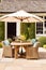 Modern cottage garden furniture, outdoor decor and countryside house patio terrace chairs and table with umbrella