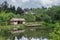 Modern cottage and a gazebo on shore of lake