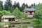 Modern cottage and a gazebo on shore of lake