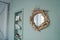 Modern cozy interior in mint color, details of eco decor, diy mirror