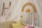 Modern crib with baby mobile in children`s room. Interior design