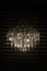 Modern crystal pendant chandelier, on a black background isolate