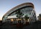Modern curved outdoor glass facade and elliptical roof of Cloud at sunrise on Queens Wharf, Auckland, New Zealand