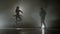 Modern dance battle between a young hip hop dancer versus a graceful beautiful ballerina -