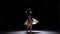 Modern dancer girl in white dress dancing contemporary, jumps on black, shadow, slow motion