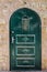 Modern Dark green emerald metal dirt door with keyhole and rusty metal lockas a beautiful vintage background