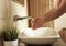 Modern designed sink with womans` hands washing in the modern bathroom