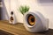 Modern designer speakers on wooden sideboard