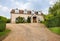 Modern detached home with gravel driveway