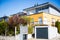 Modern detached houses with flat roof and garage