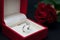 Modern diamond engagement ring in red box